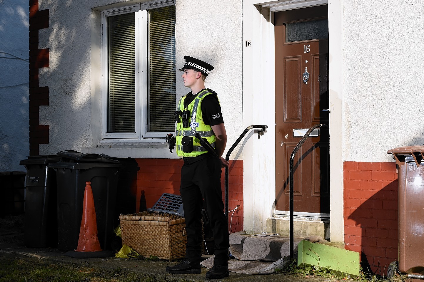 A police officer at the scene of the incident on Middlefield Terrace. Picture by Kenny Elrick