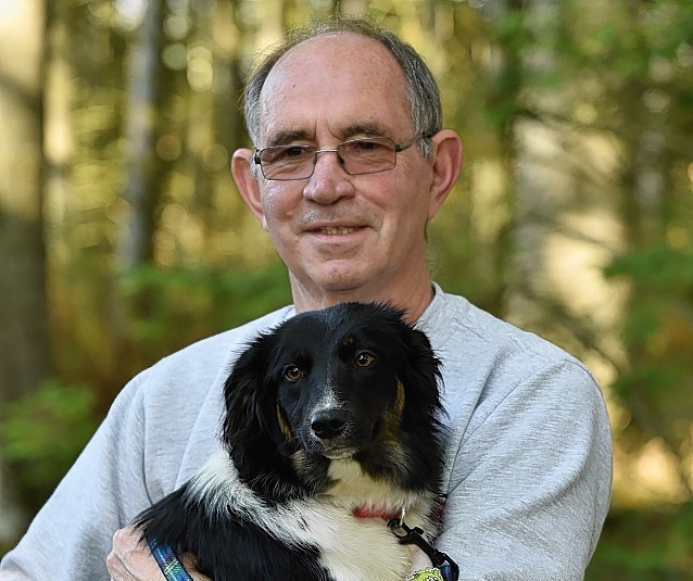 Foster carer John Smith, 72, with Mist the border collie. Picture by Colin Rennie