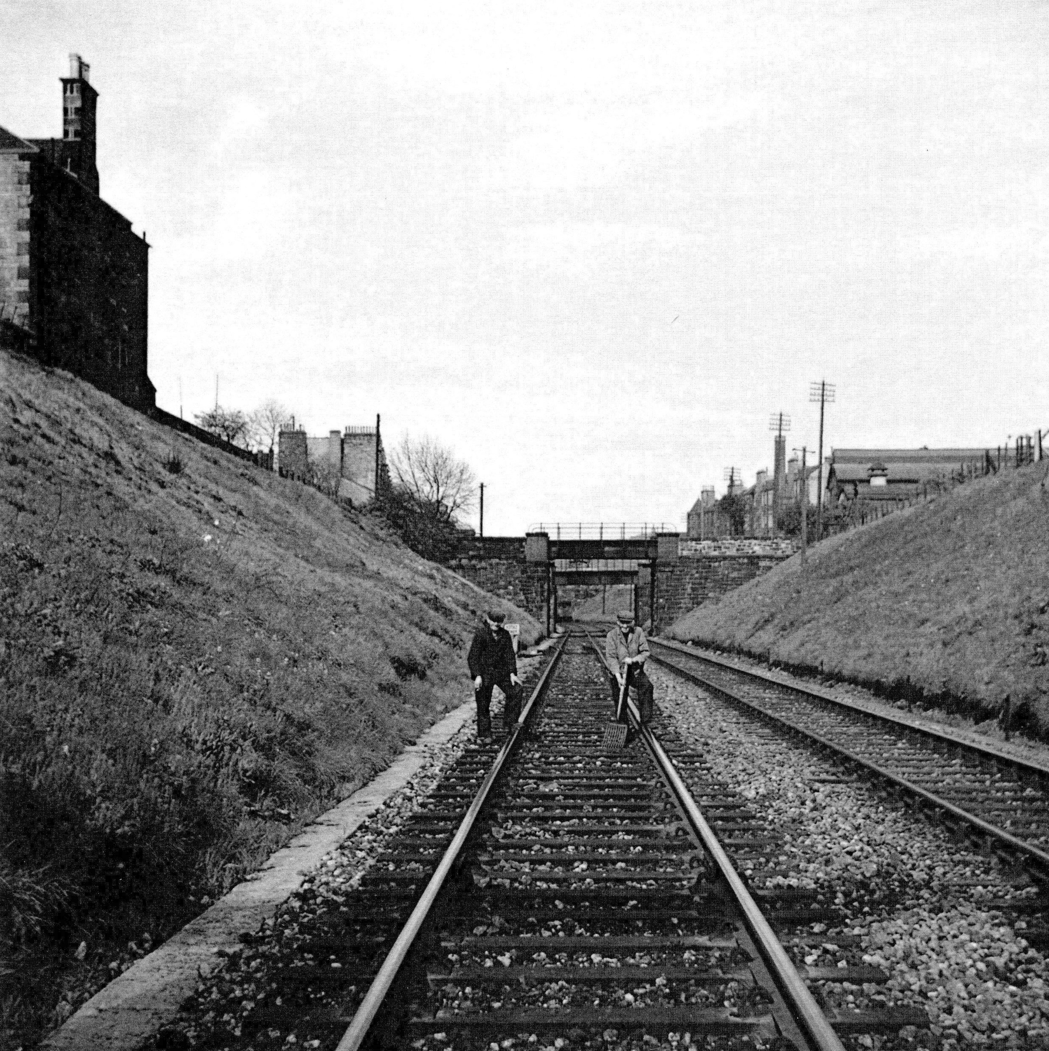 Men on the train tracks. 