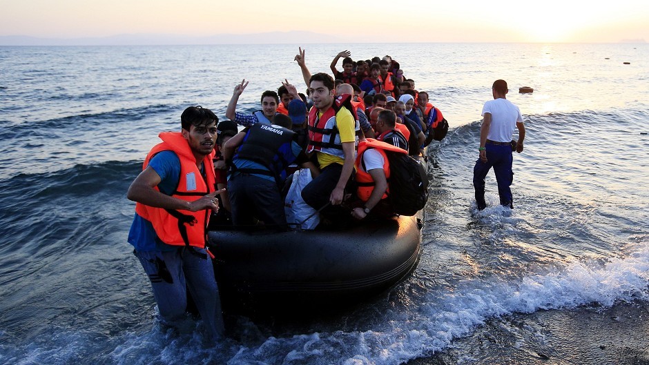 Migrants and refugees arrive on the beach at Psalidi near Kos Town, Greece