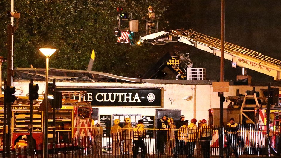 Police and fire and rescue services at the scene of the helicopter crash at the Clutha Bar in Glasgow