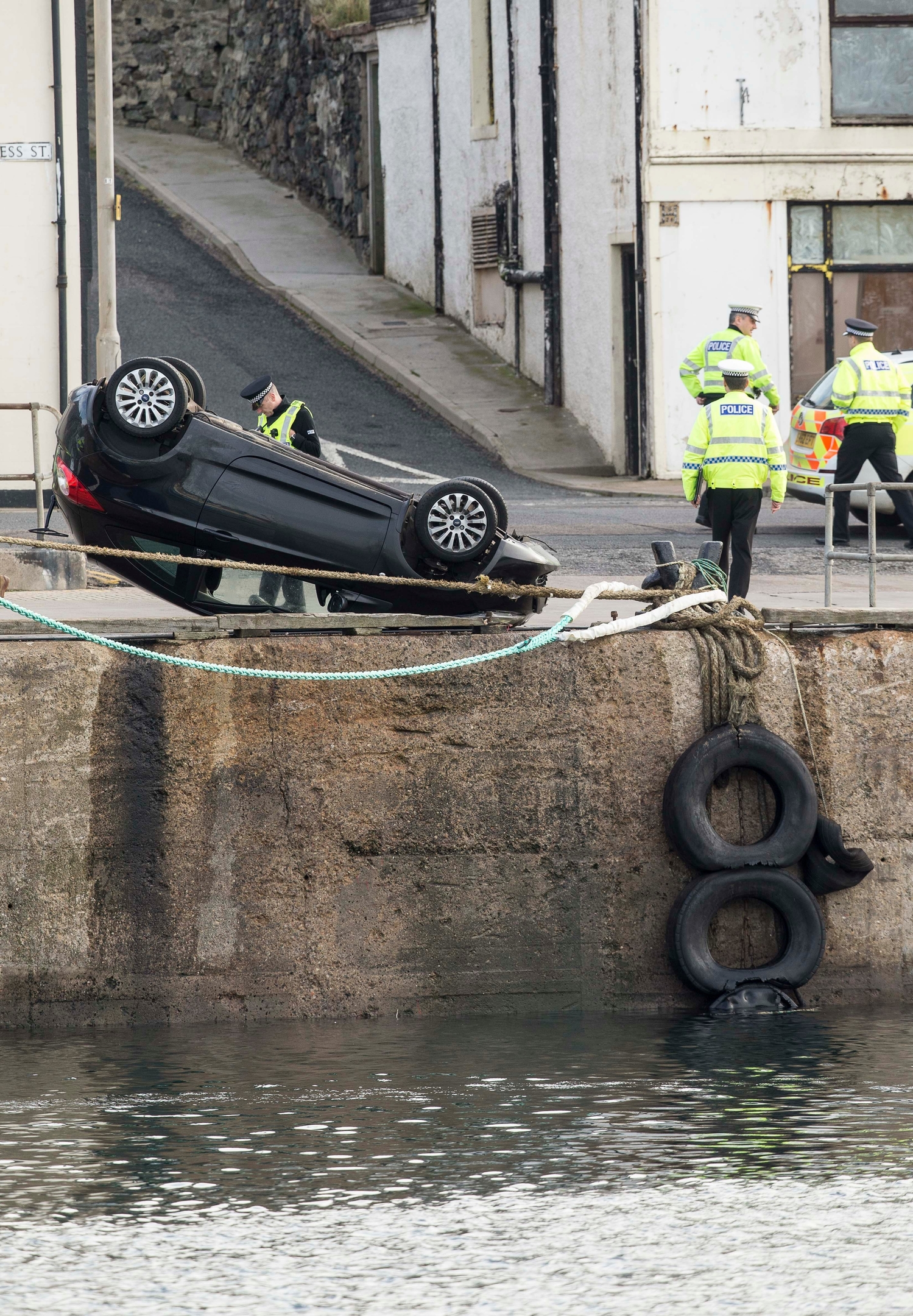 CAR ENTERS THE HARBOUR AT MACDUFF, ABERDEENSHIRE. PIC OF THE FORD KA DRIVER BY A FEMALE WHO WAS RESCUED FROM THE HARBOUR AND FLOWN BY AIR AMBULANCE TO ABERDEEN ROYAL INFIRMARY PIC DEREK IRONSIDE / NEWSLINE MEDIA