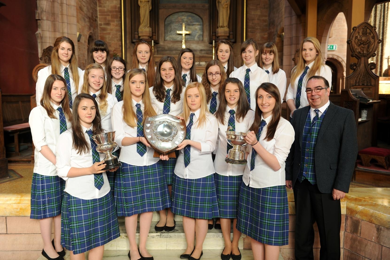 Picture by SANDY McCOOK   13th October '15 Royal National Mod Oban 2015 (Tuesday)  Sir E Scott School from Tarbert, Harris with their conductor Iain MacIvern and their trophies, the Mrs Campbell-Blair Trophy, The Angus M Ross Trophy and the Belle Campbell Trophy.