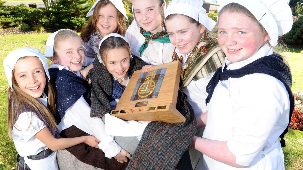 Clan Trotternish from Staffin and Kilmuir on Skye with the Harris Tweed Authority Award for their Waulking Song.