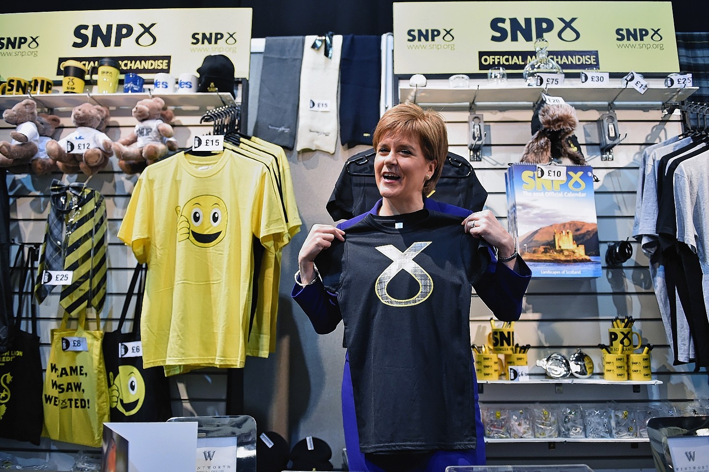  First Minister of Scotland and SNP leader Nicola Sturgeon visits a stall on day two of the 81st annual conference at the Aberdeen Exhibition and Conference Centre 