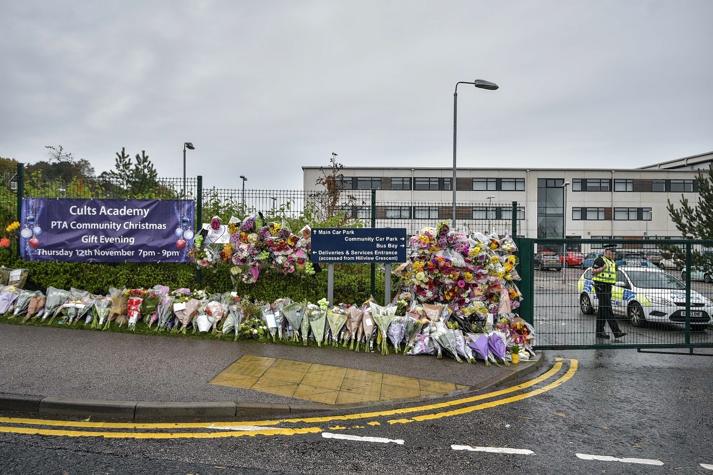 Floral tributes outside Cults Academy, left for Bailey Gwynne