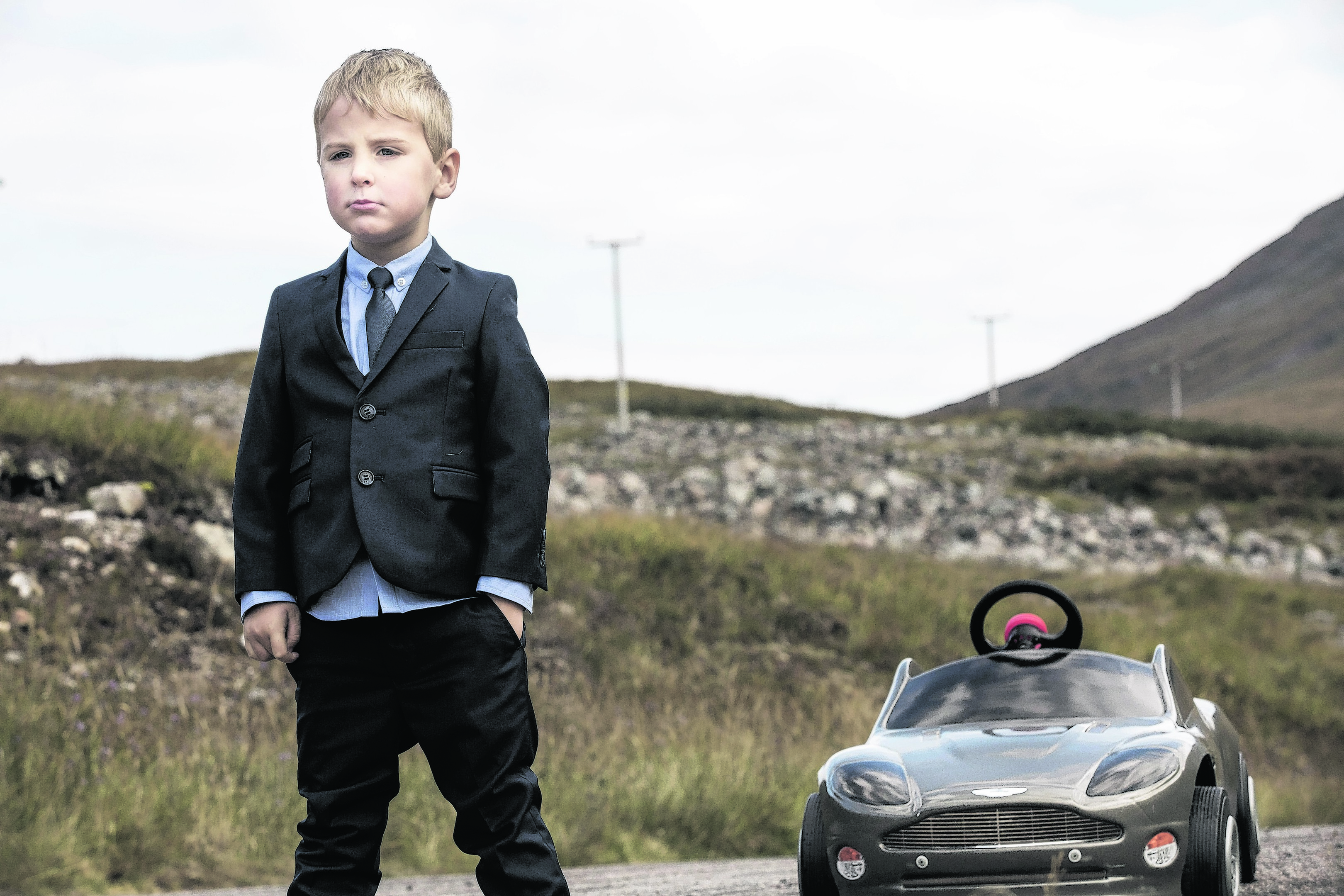 Young Mikey Bell recreates a scene from Skyfall on a  visit to Glen Etive in the Highlands. 
Photo: James Glossop for VisitScotland