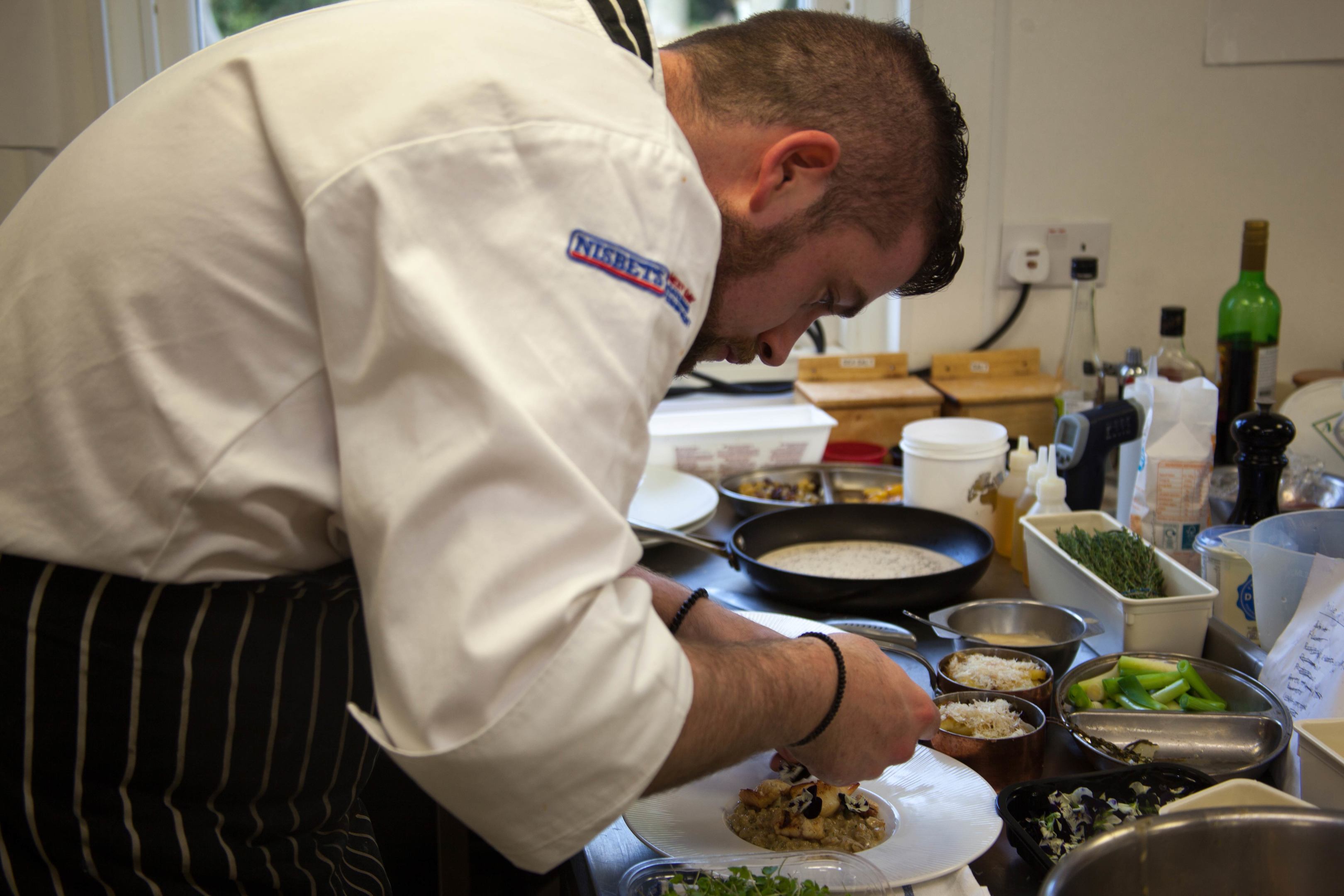 Young Highland Chef David MacDonald puts the finishing touches to his dish