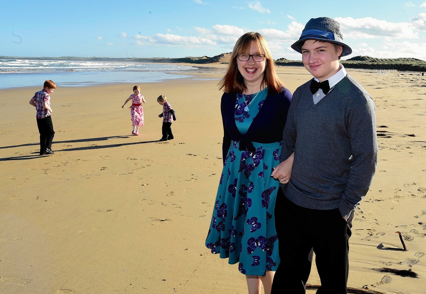 Zachery Cates with his mum Angela. Siblings Phoebe, 8, Joe, 9, and Coby, 4, play in the background.