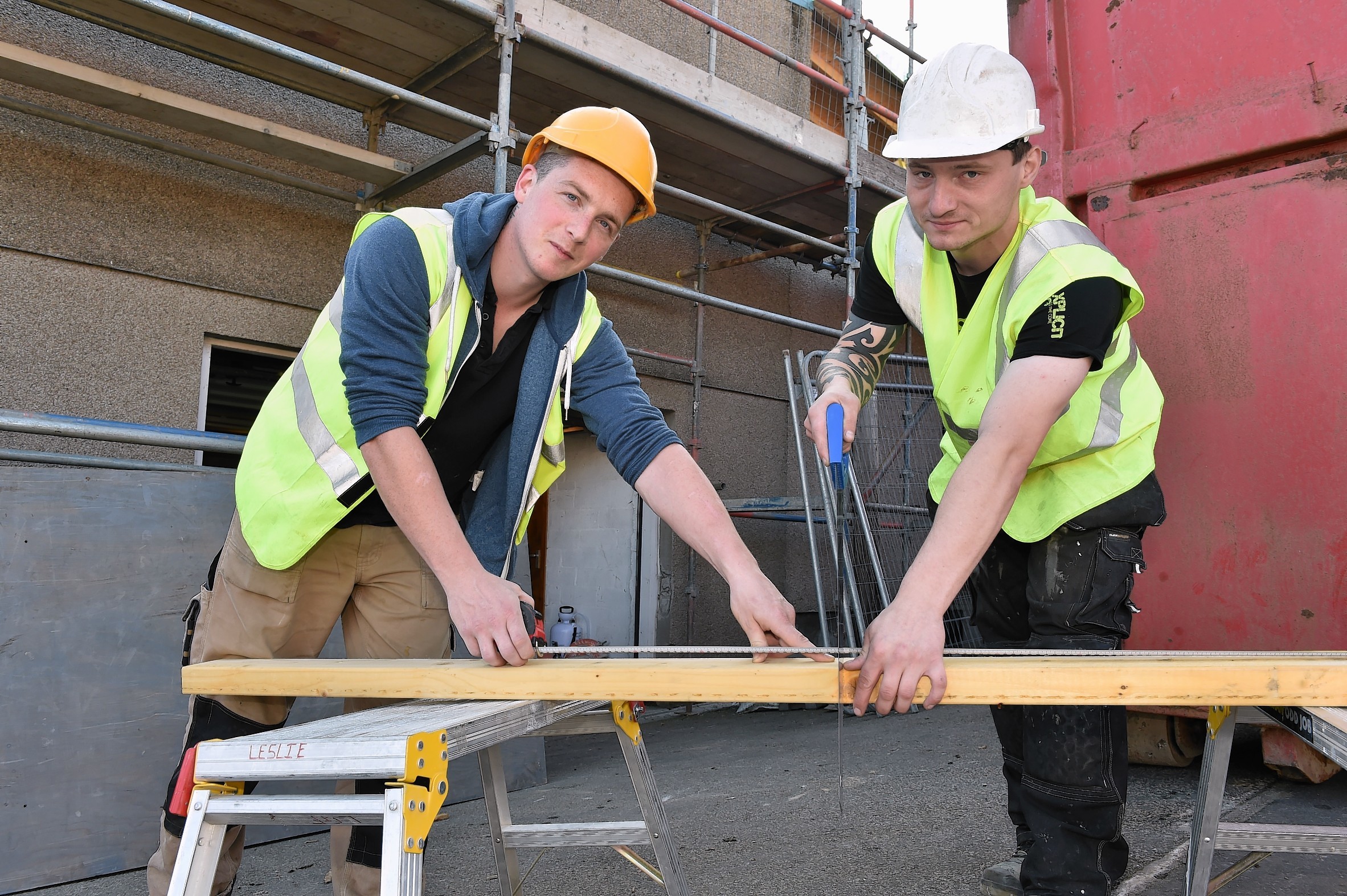 Apprentice joiners Ben Hammond (left) and Matt Markuszewski working on the roof of the Sea Cadets building in Peterhead.