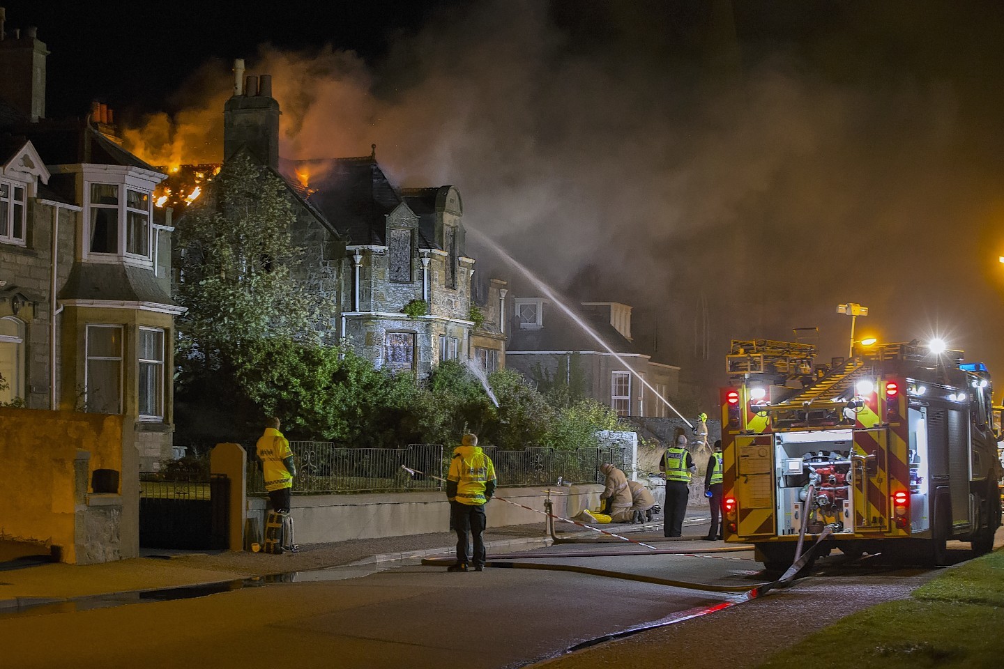 Firefighters are battling a "well-established" fire in Moray