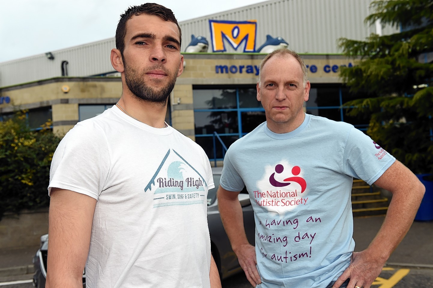 Kev Anderson, left, with Glyn Morris, chairman of the National Autistic Society outside the Moray Leisure Centre in Elgin