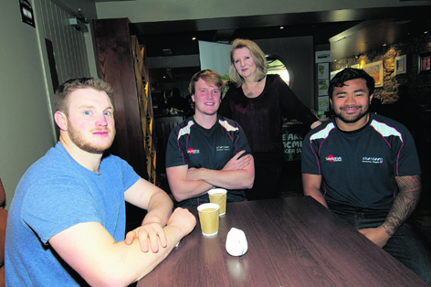 Muriel Roberts with Aberdeen Grammar rugby players Tony McGinness, Stuart Smith and John Poe