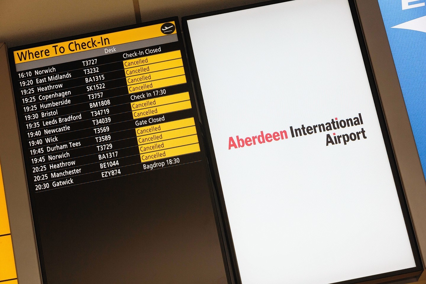 Boards at Aberdeen Airport show the lengthy list list of cancellations 