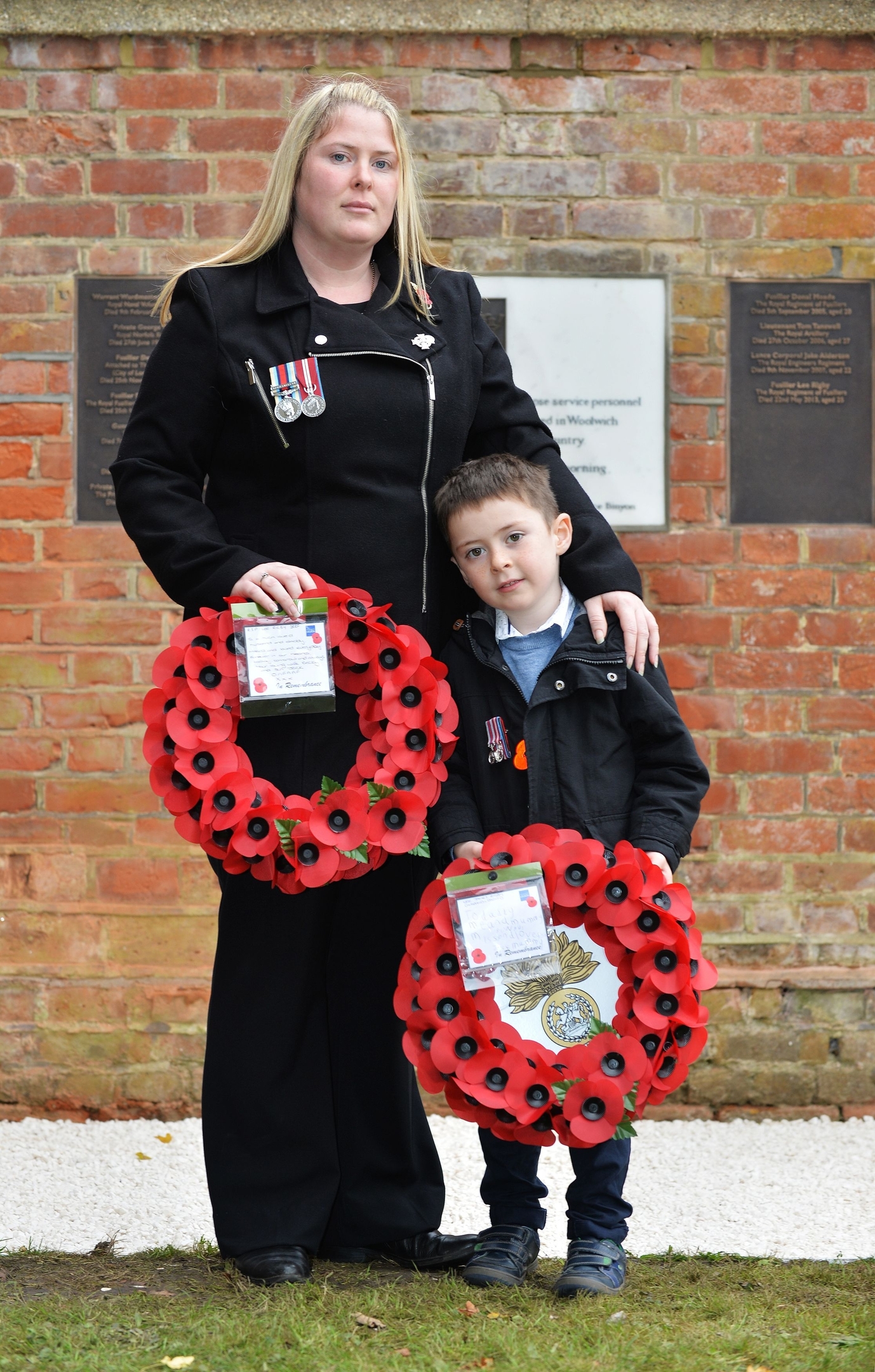 Handout photo issued by the MoD of Rebecca Rigby, the widow of murdered Fusilier Lee Rigby, and son Jack as they attend a service at St George's Chapel in Woolwich, to mark Armistice Day, the anniversary of the end of the First World War. 