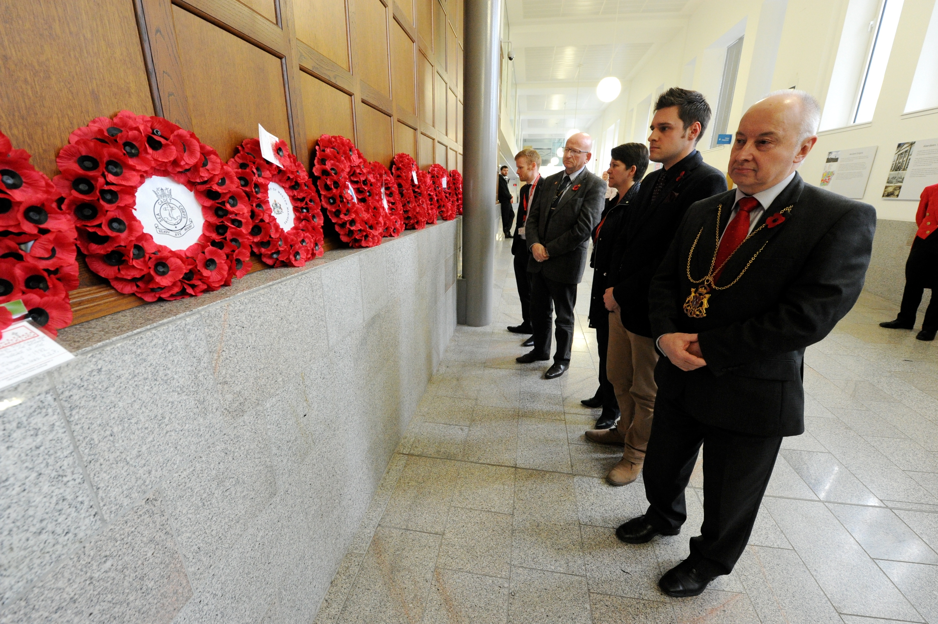 Aberdeen Lord Provost George Adam joined council staff and members of the public at Marischal College customer service area to remember the nation's war dead, and observe the national two-minute silence. Picture by KENNY ELRICK 11/11/2015