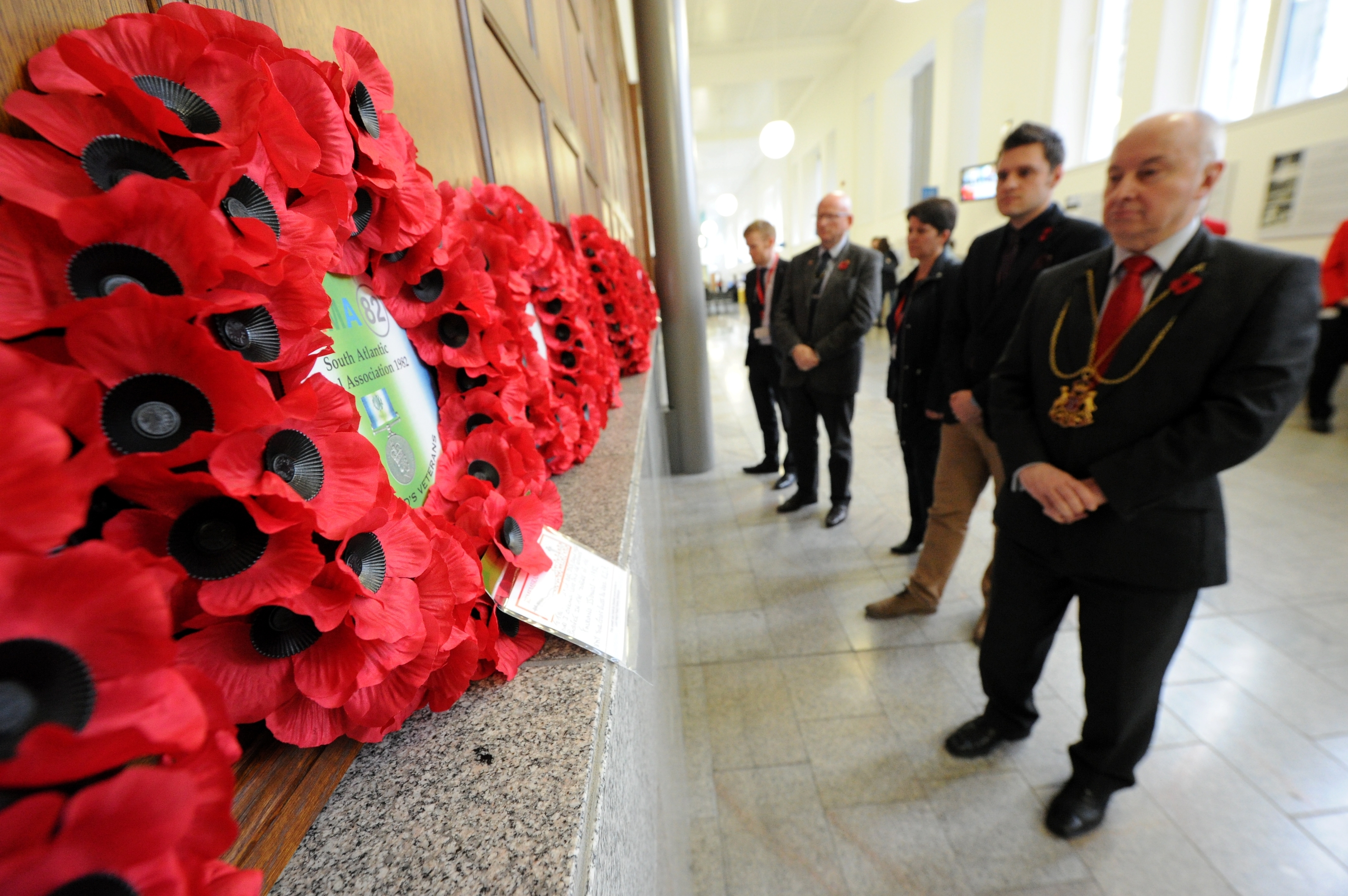 Aberdeen Lord Provost George Adam joined council staff and members of the public at Marischal College customer service area to remember the nation's war dead, and observe the national two-minute silence. Pictures by KENNY ELRICK 