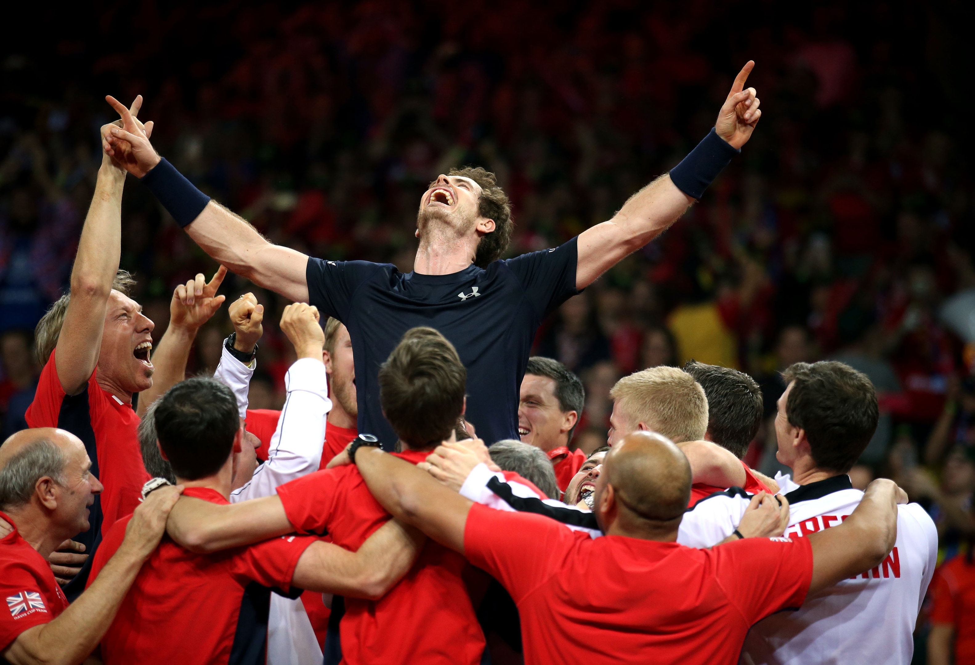 Great Britain's Andy Murray is mobbed by his team-mates after beating David Goffin during day three of the Davis Cup Final at the Flanders Expo Centre