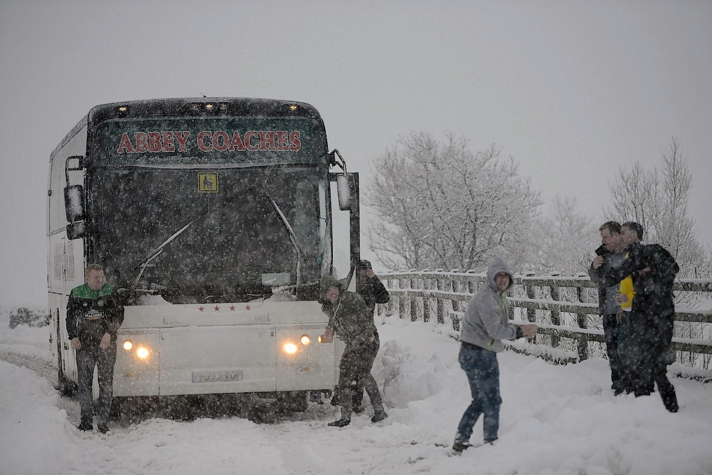 Celtic fans on their way to Inverness have a snow fight on the Drumochter pass 