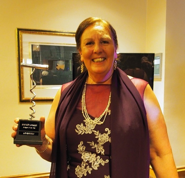 Elizabeth Ferguson proudly displays her award