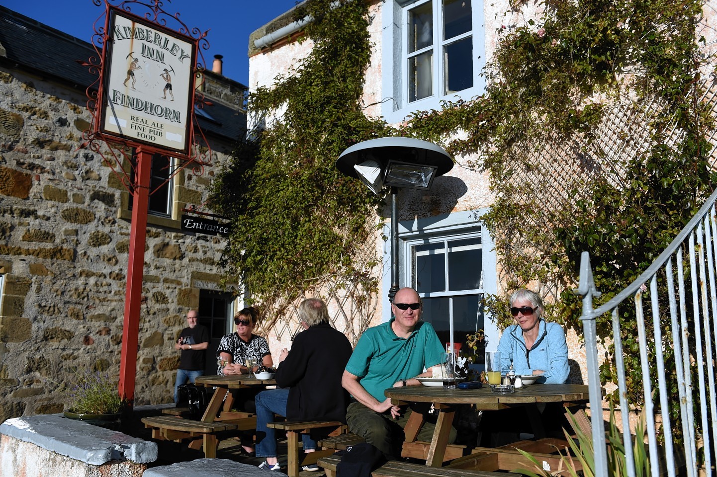 Two couples, Ewan and Margaret Lawson, left, and Ray McGaan and Andrew Walker, right, enjoy an al fresco lunch at the Kimberley Inn, Findhorn, in glorious November sunshine. Picture by Gordon Lennox