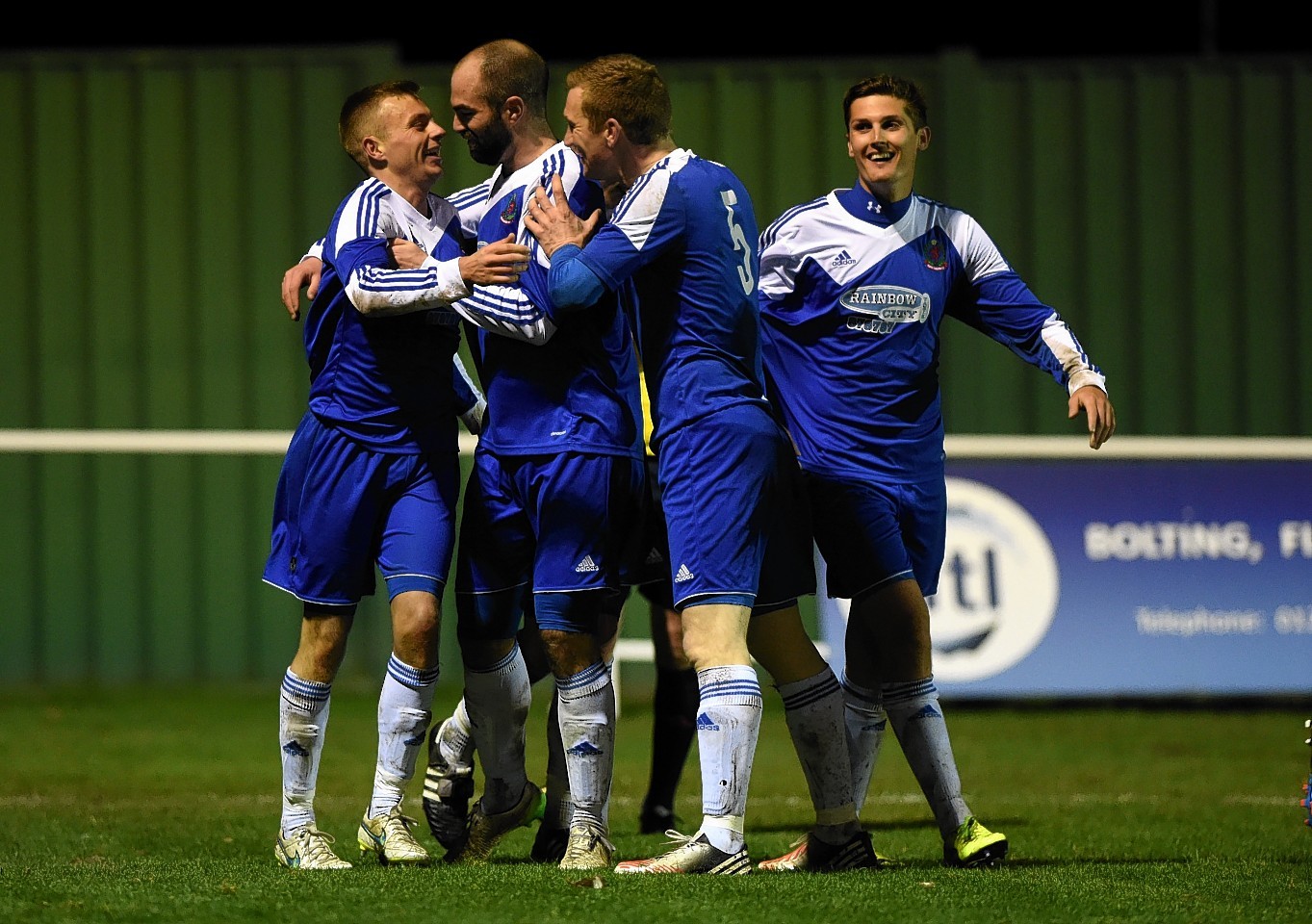 Daryl Nicol celebrates with team mates after scoring his spectacular overhead kick