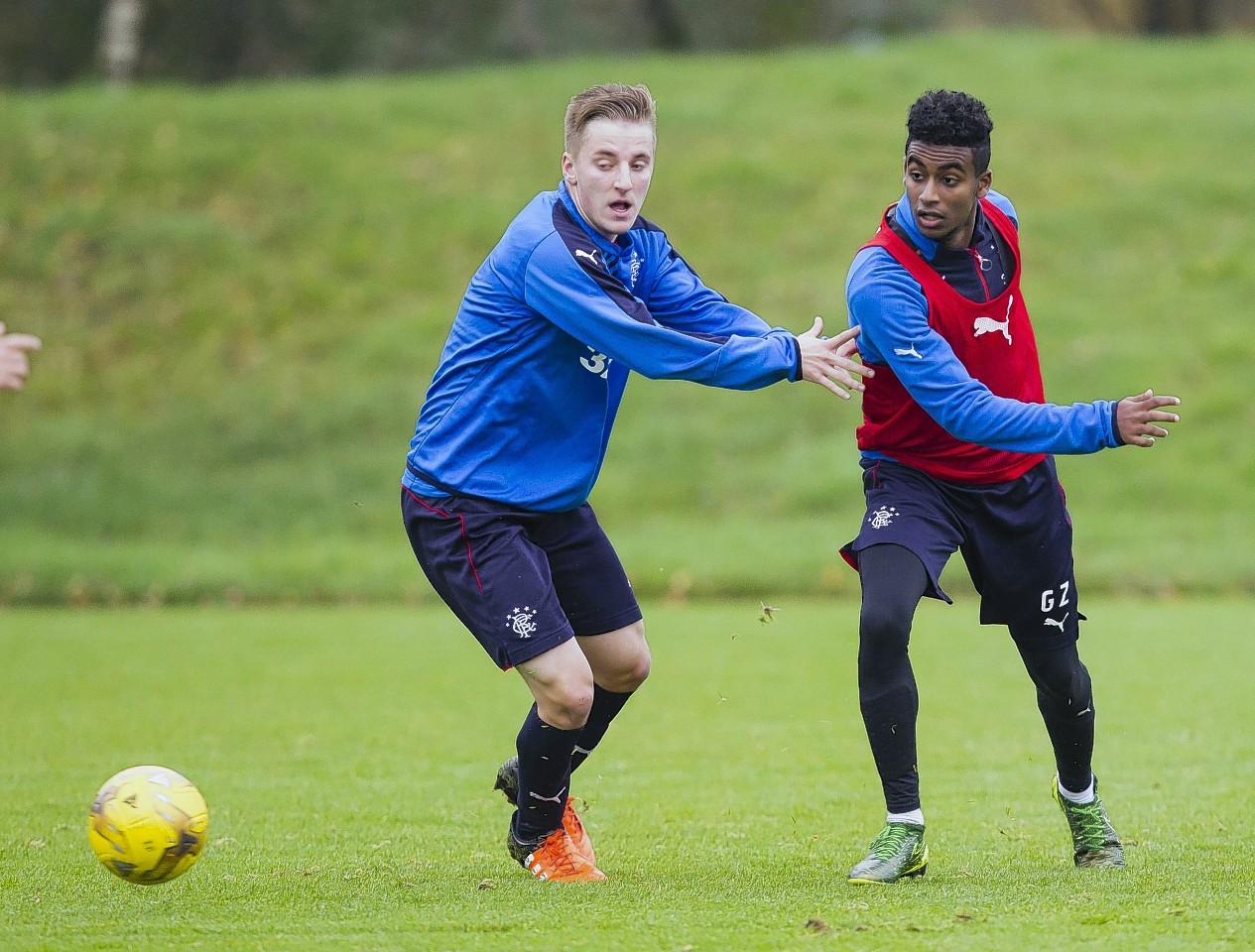 George Glendon (left) closes down Gedion Zelalem in training