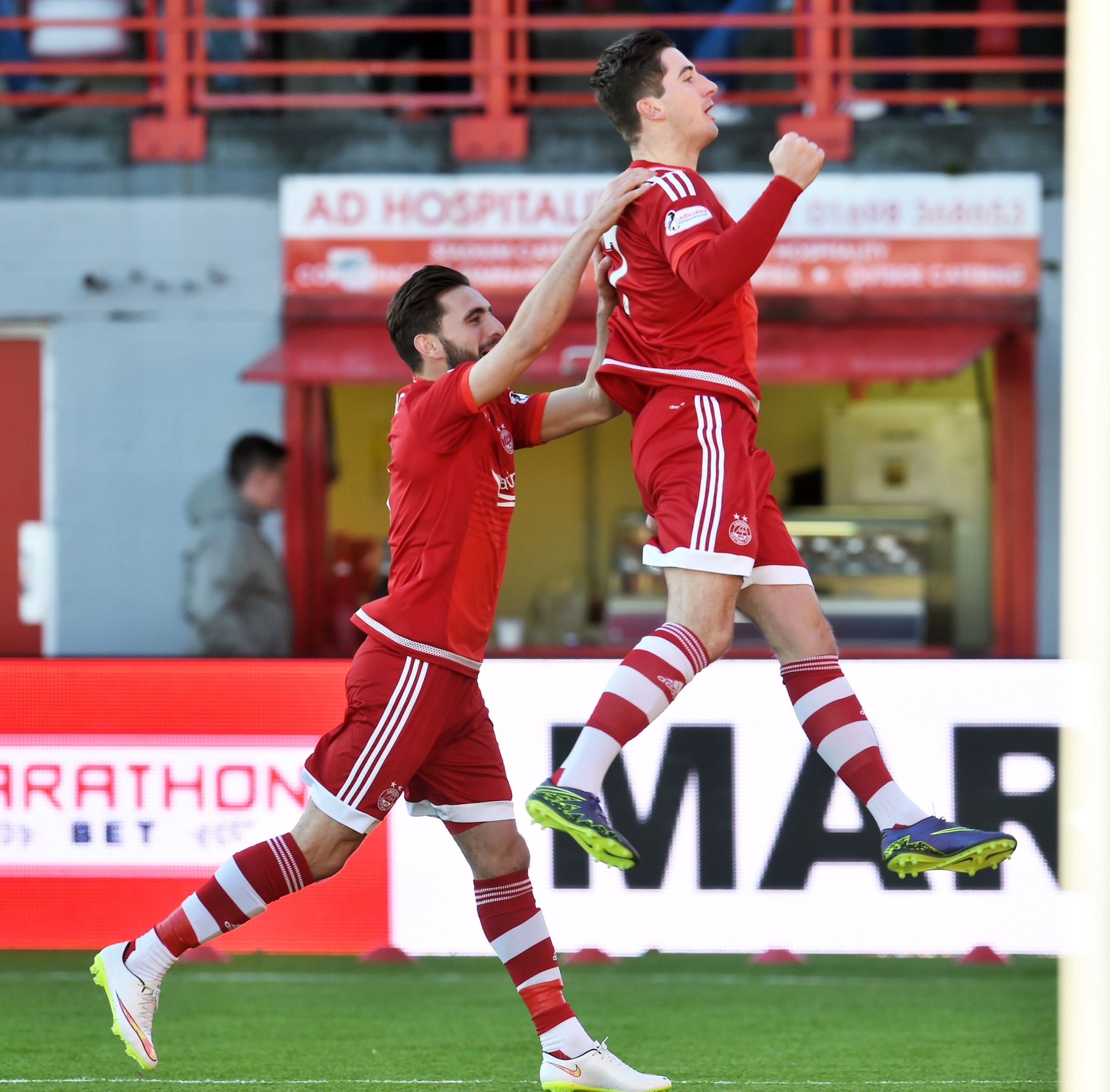Kenny McLean (right) celebrates his goal with Graeme Shinnie