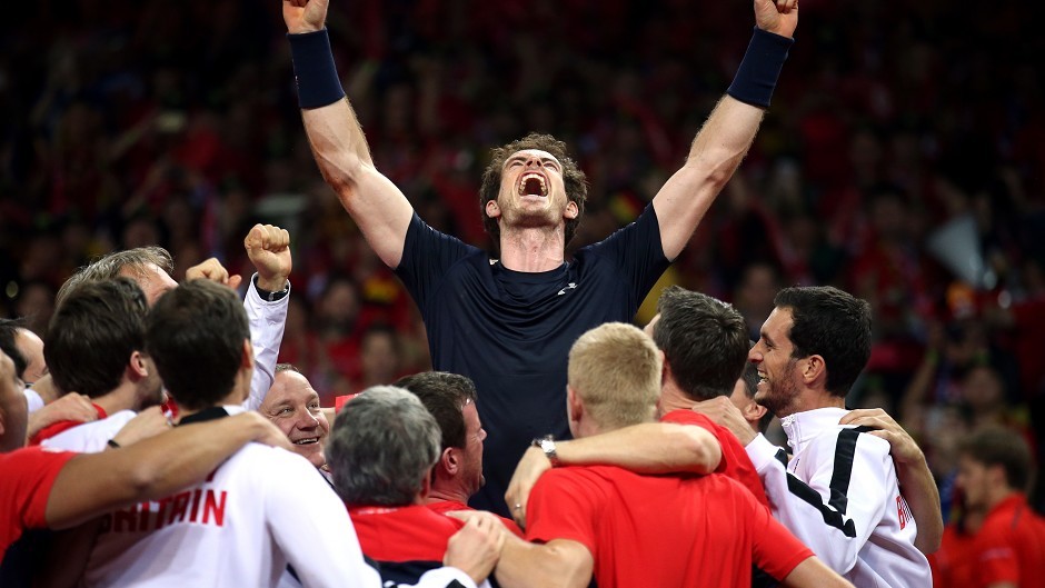 Andy Murray mobbed by his team-mates after beating David Goffin during day three of the Davis Cup Final at the Flanders Expo Centre, Ghent