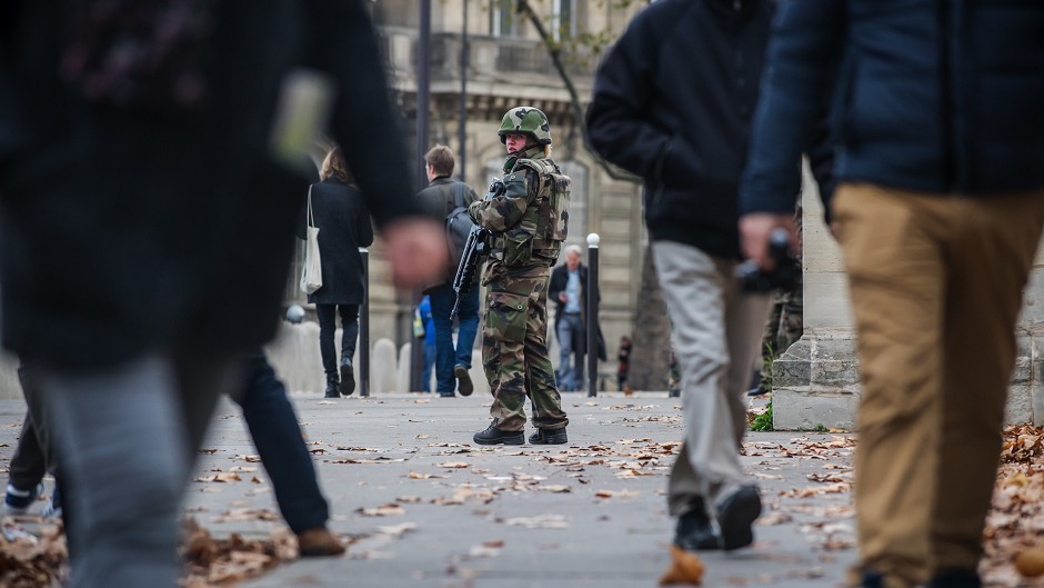 A soldier patrols outside the French National Assembly in Paris (AP)