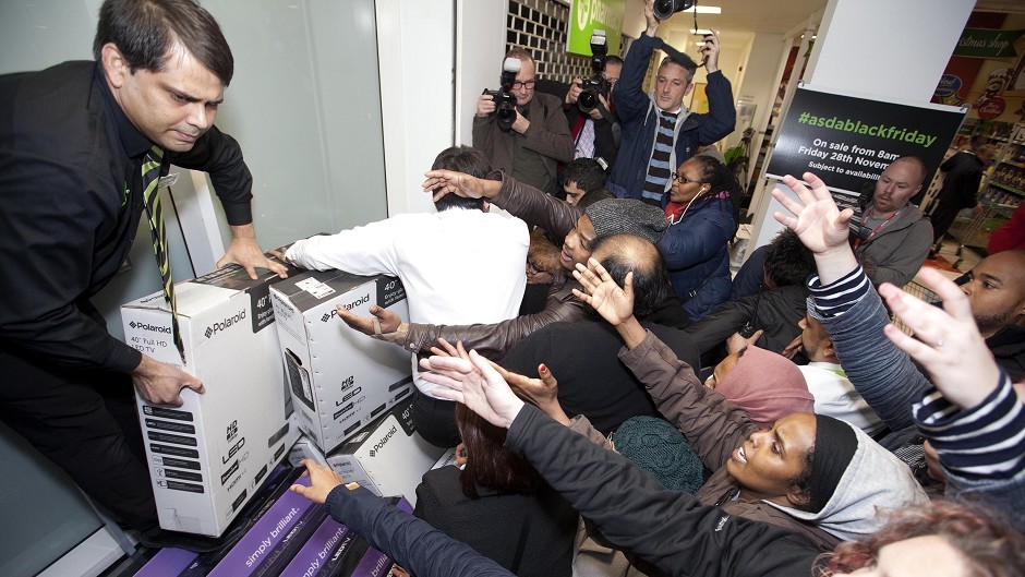 Shoppers in London get involved in the Black Friday rush