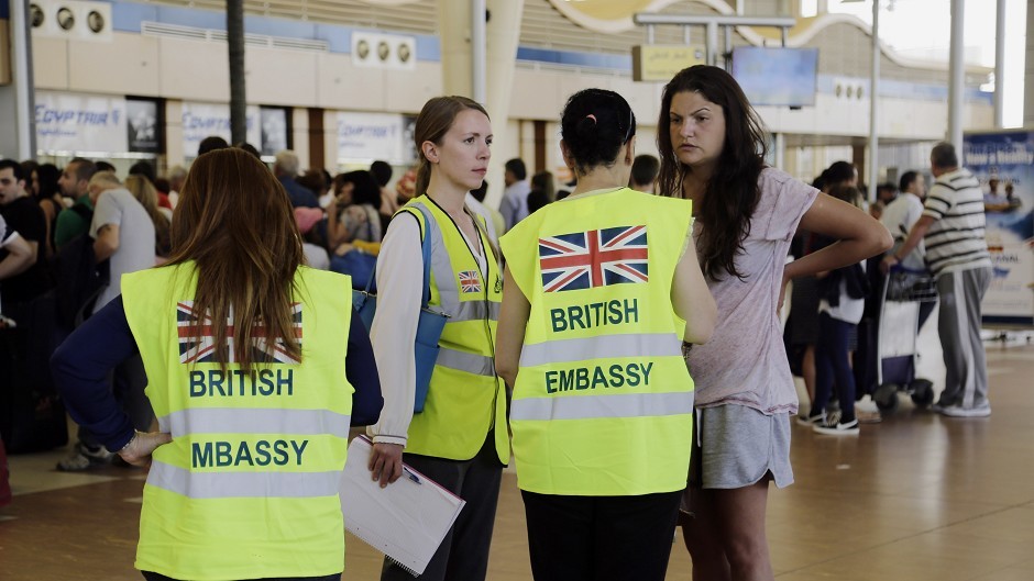 British Embassy staff talk to tourists at Sharm el-Sheikh International Airport (AP)