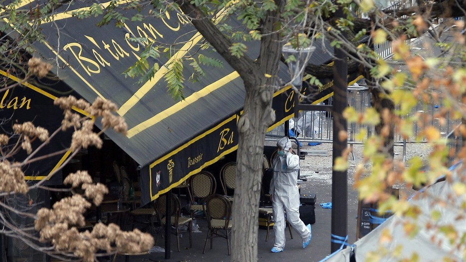 An investigator works outside the Bataclan concert hall (AP)