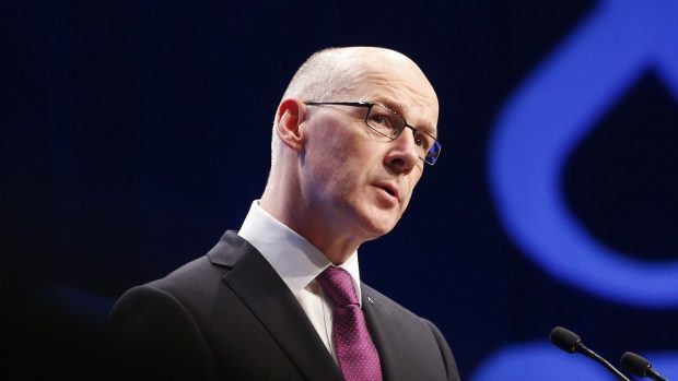 Deputy First Minister John Swinney has faced criticism for the "ill thought out" policy