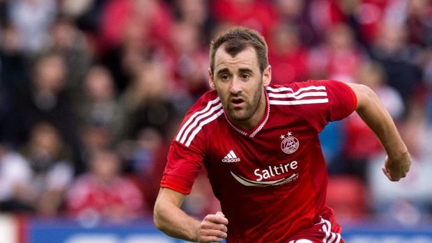 Aberdeen's Niall McGinn was impressed by how he and his team-mates dug deep to beat Ross County
