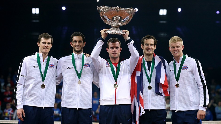 Great Britain's captain Leon Smith lifts the Davis Cup trophy