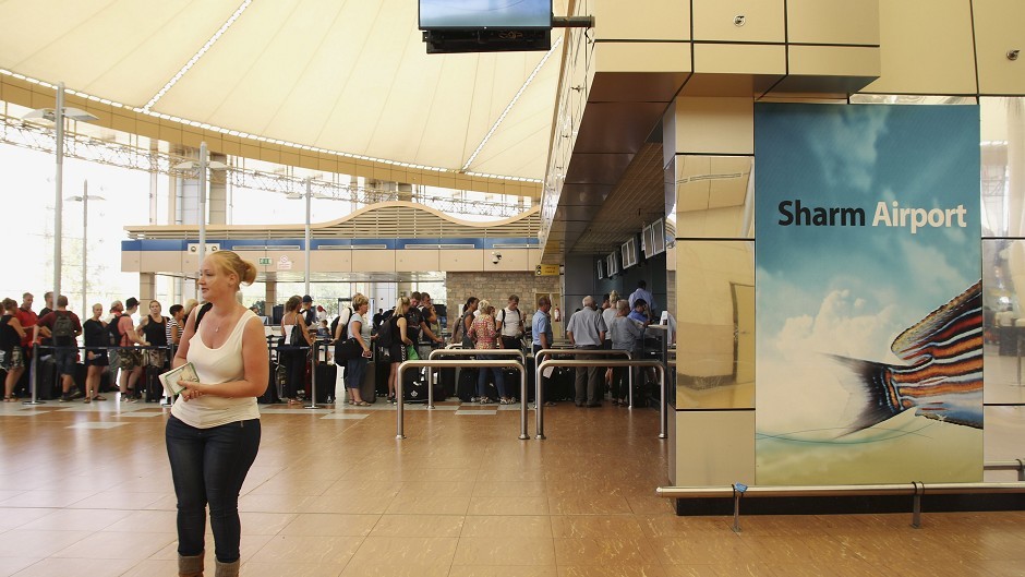 Tourists wait in the departure hall to be evacuated from Sharm el-Sheikh airport, south Sinai, Egypt (AP)