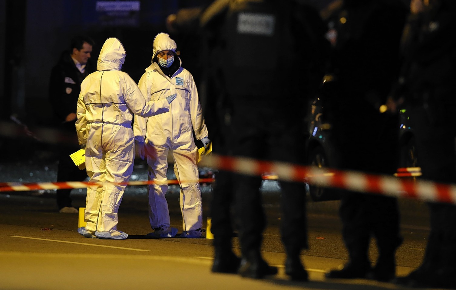 Investigating police officers work outside the Stade de France 