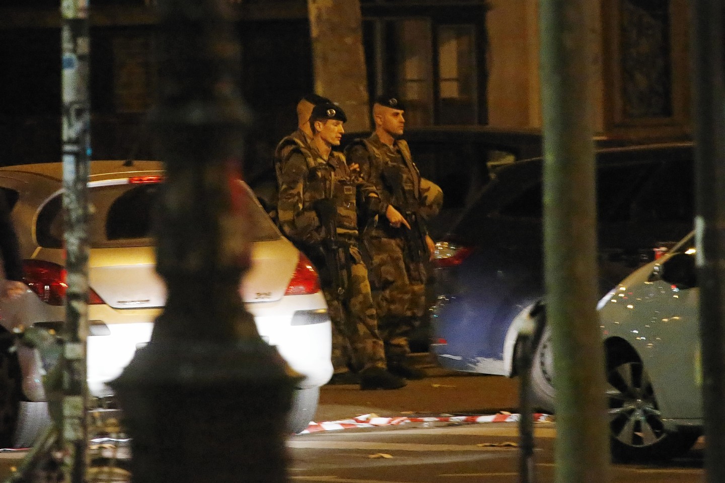 French soldiers patrol after a shooting outside the Bataclan Music Hall