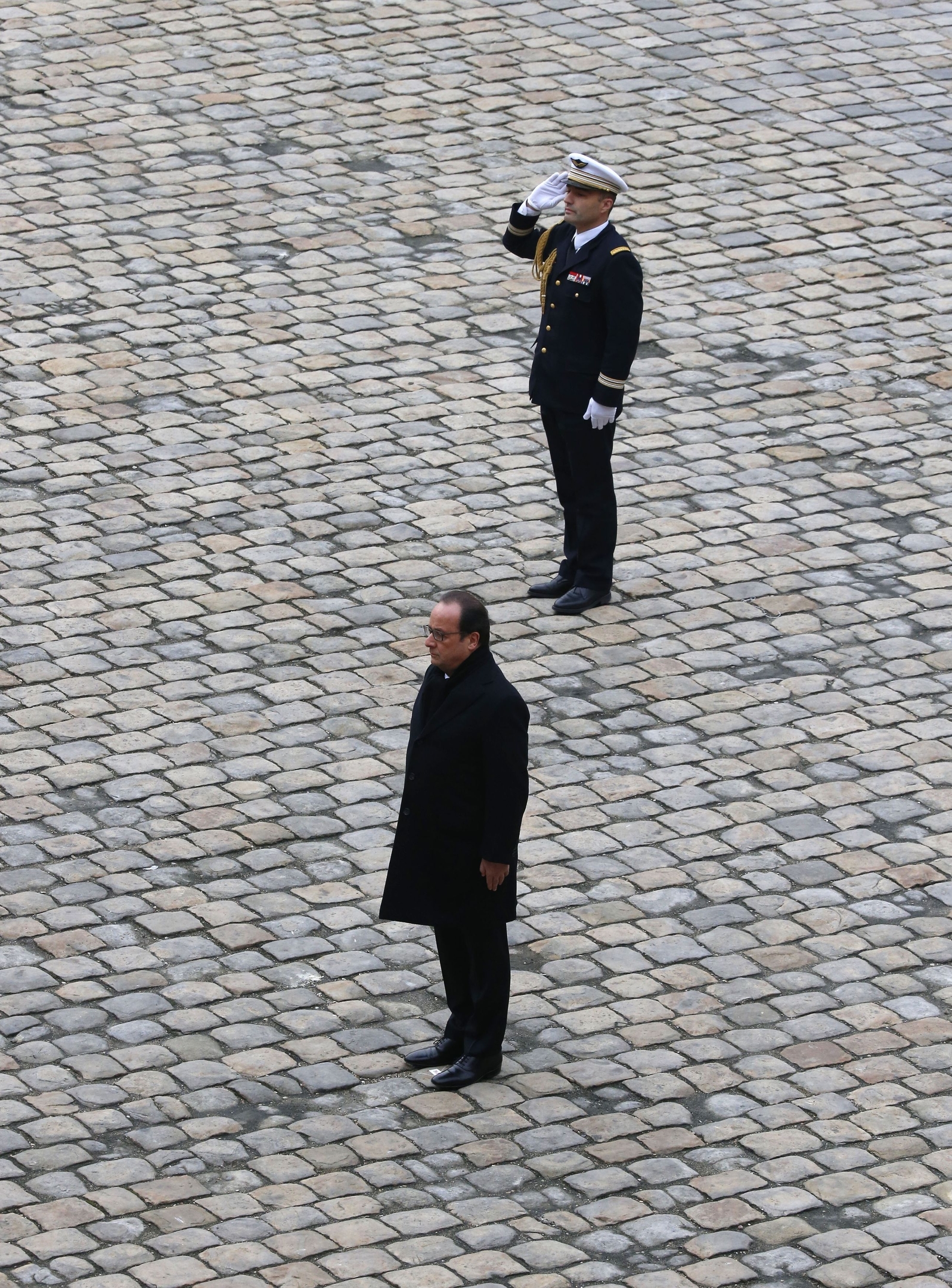 French President Francois Hollande arrives at a ceremony in the courtyard of the Invalides in Paris