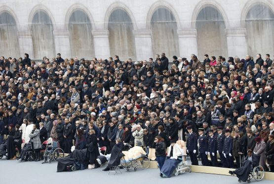 Wounded people attend the memorial