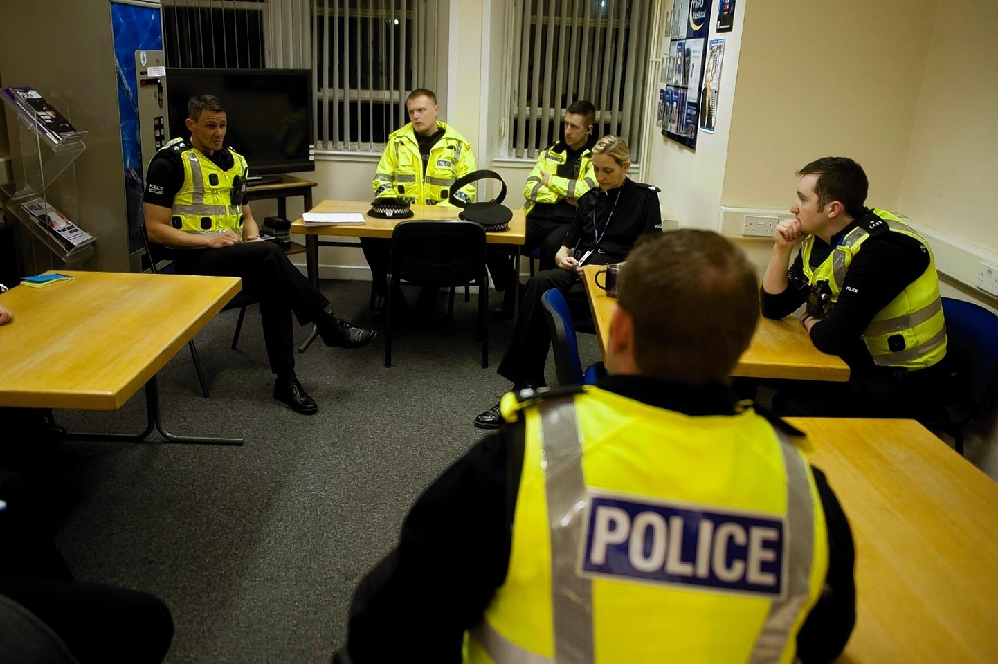 Inspector Rob Sturton holds a meeting before the officers head out onto the streets for the night
