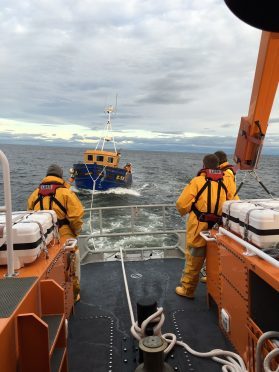 Buckie lifeboat towing The Jasper to shore, pic provided by the RNLI