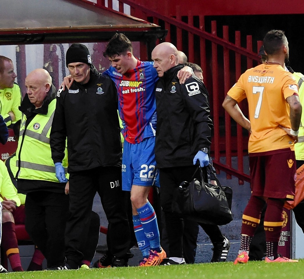 Ryan Christie is helped off the pitch
