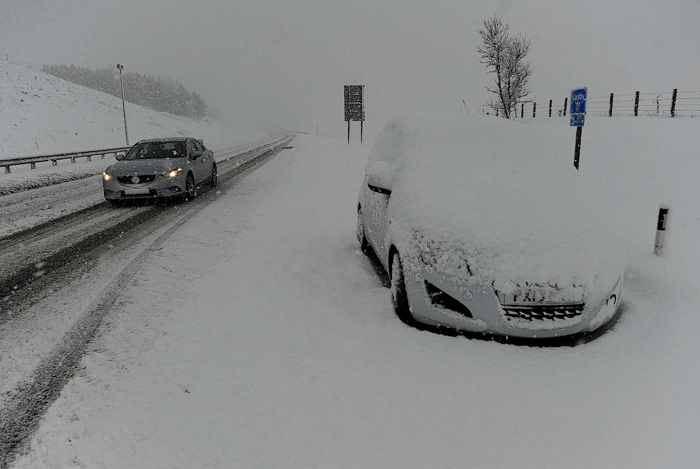 Horendous driving conditions on the Drummochter pass in the Scottish Highland