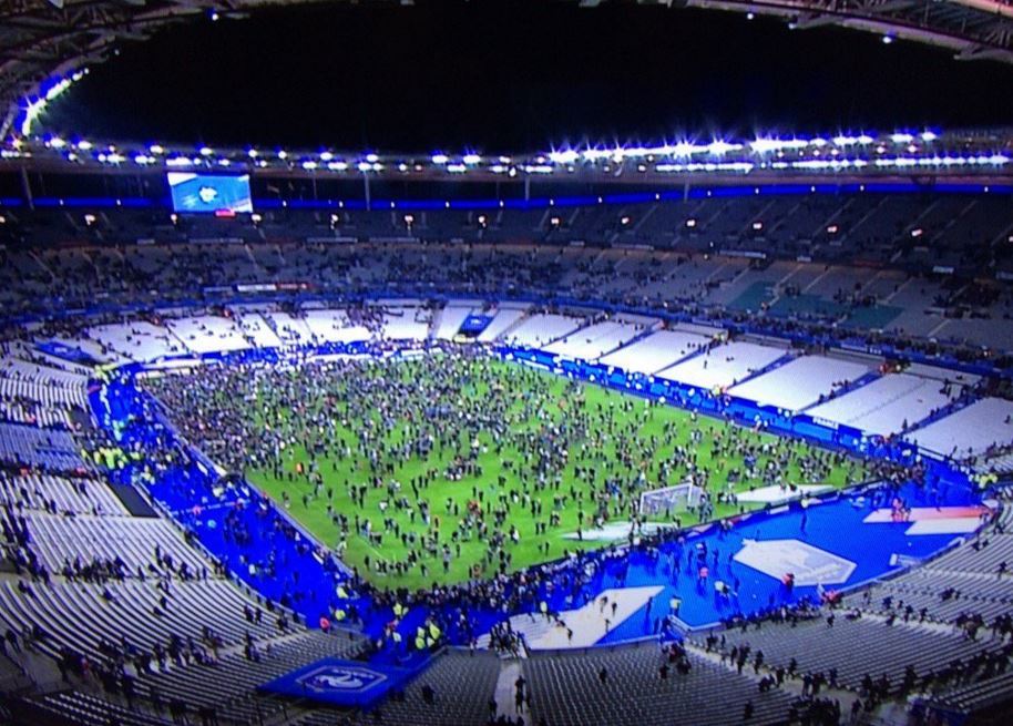 Thousands of fans at the Stade de France were forced onto the pitch following a series of explosions 