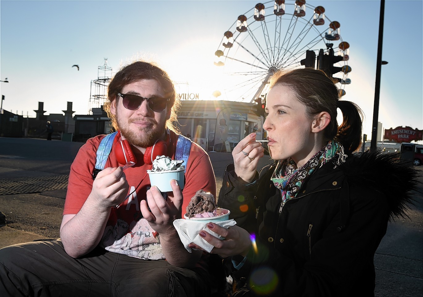 Keir Neill and Sarah Robertson enjoying an ice-cream at Aberdeen Beach yesterday. Picture by Kevin Emslie