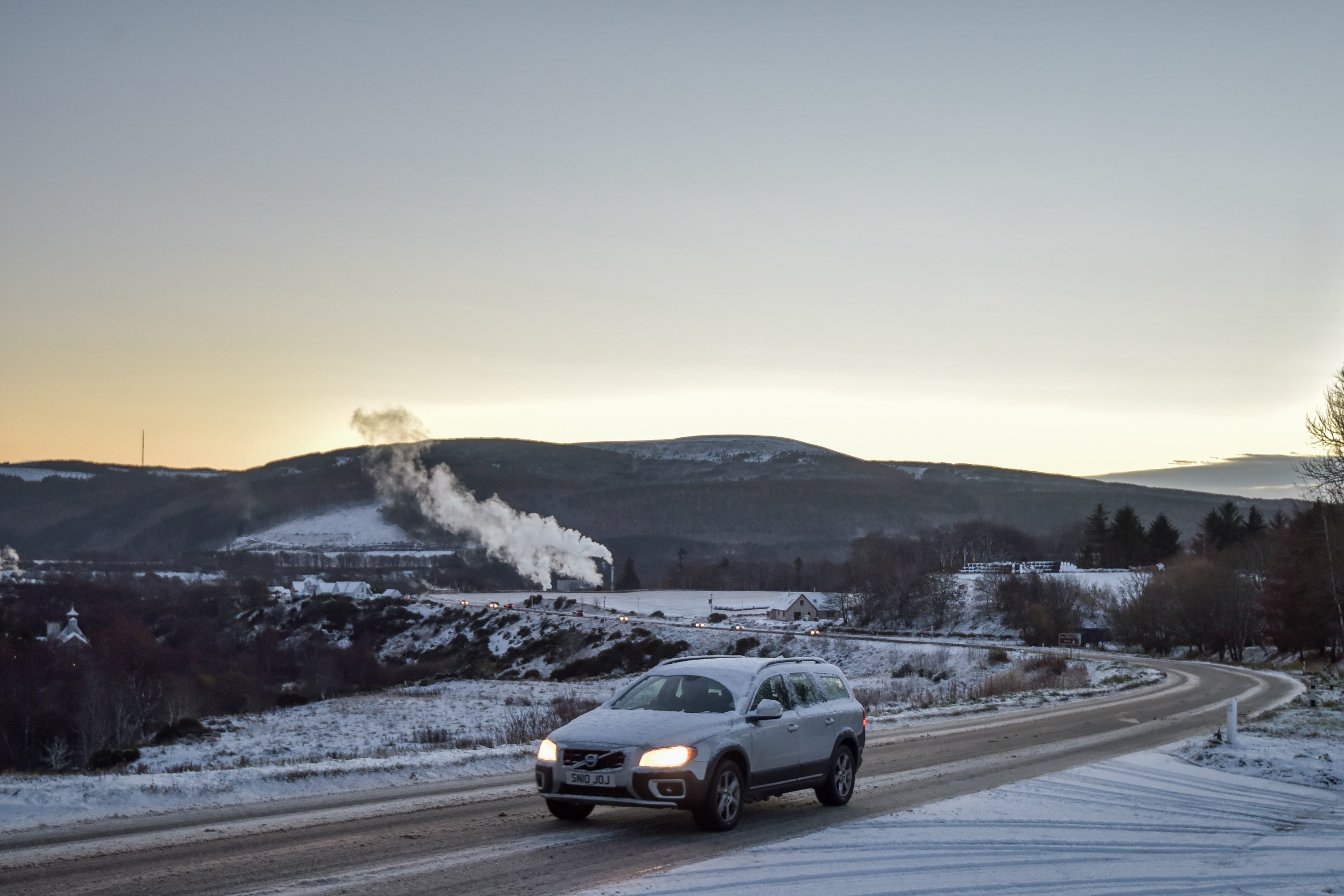 A car is seen driving in wintery conditions near Rothes, Moray on November 30 2015. Storm Clodagh has brought high winds and snow showers which covered the north of Scotland.