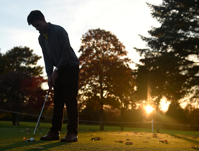 David Grindell, assistant pro at Inverness Golf Club, makes the best of the fading November sunshine