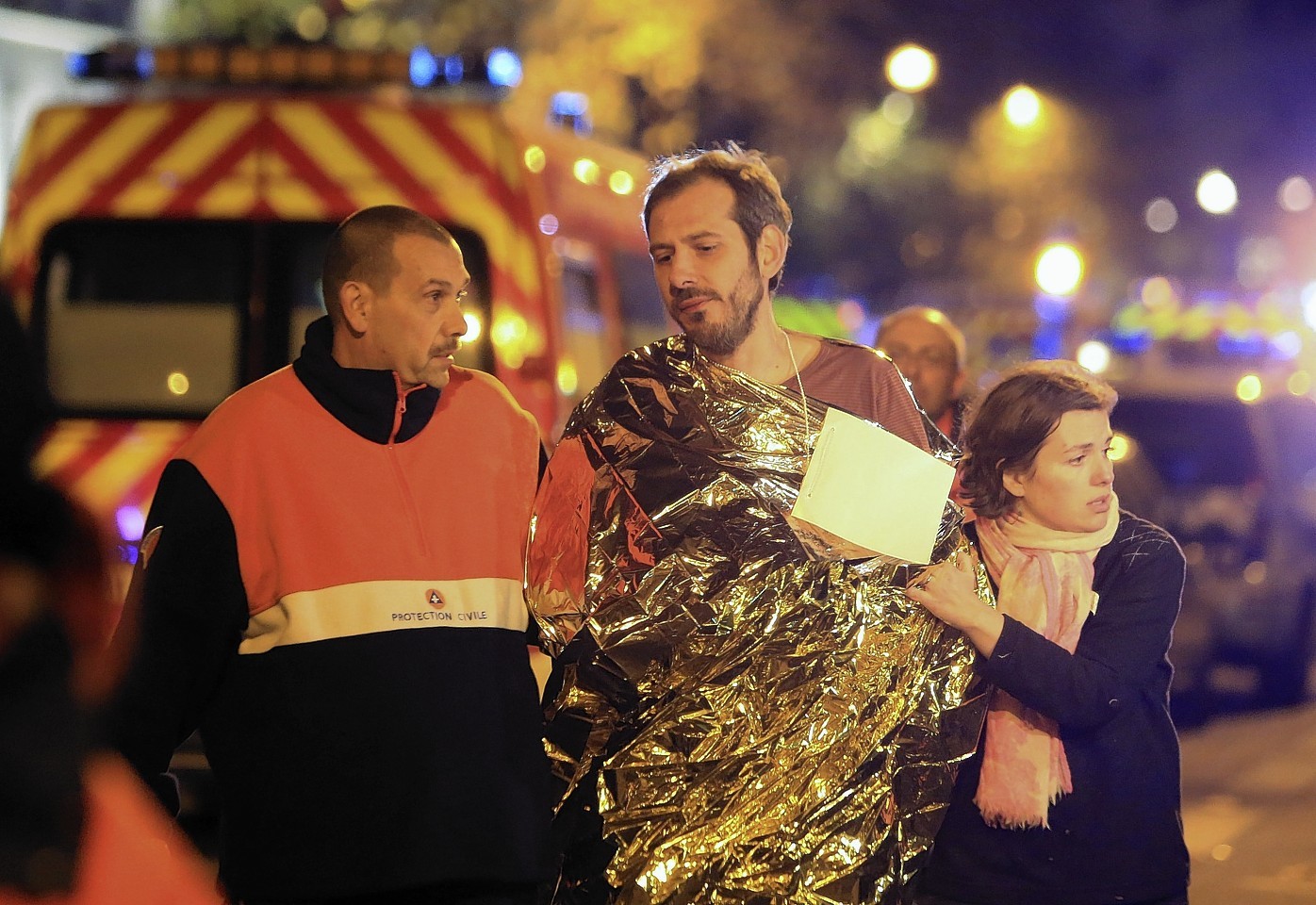 An injured man being evacuated from the Bataclan Music Hall